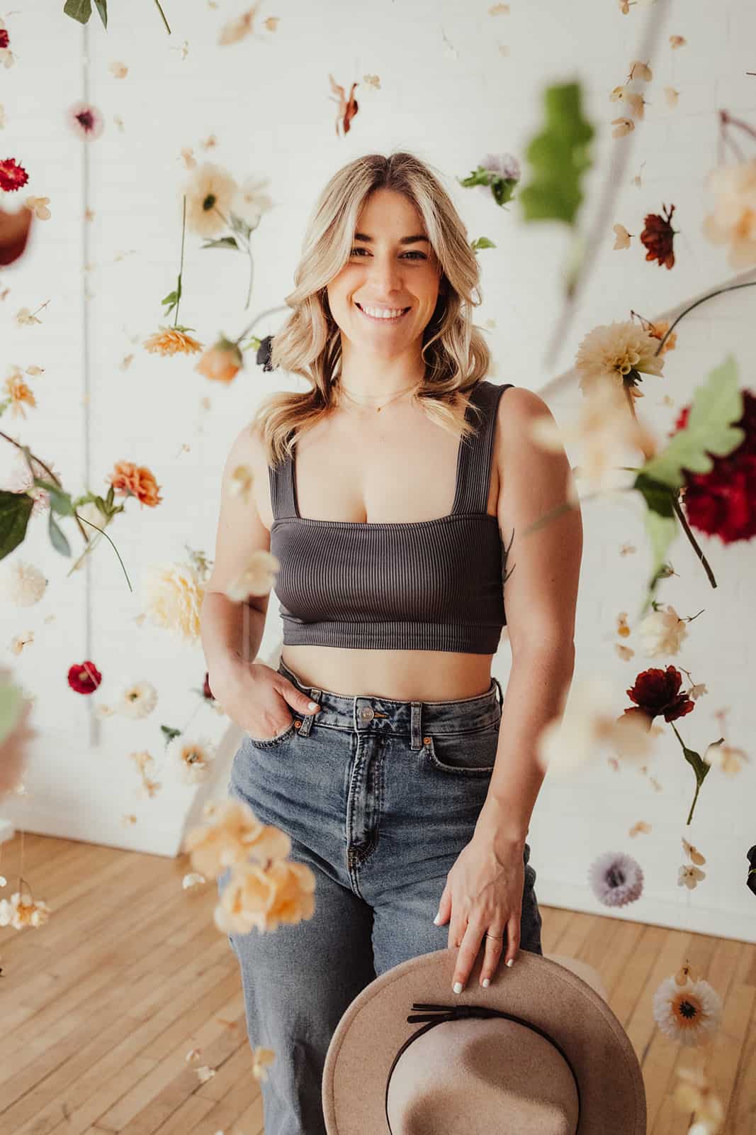 Portrait of Helene in studio with floating flowers