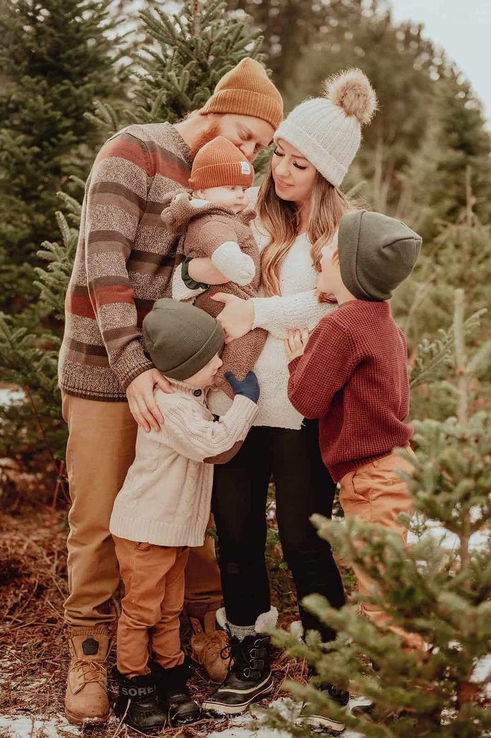 Family in outdoor tree farm